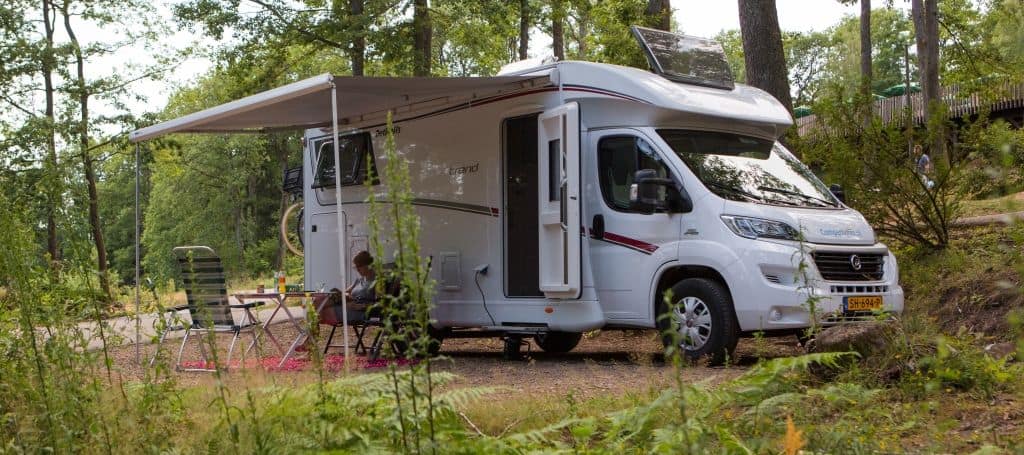 Semi-integrated camper on a campsite